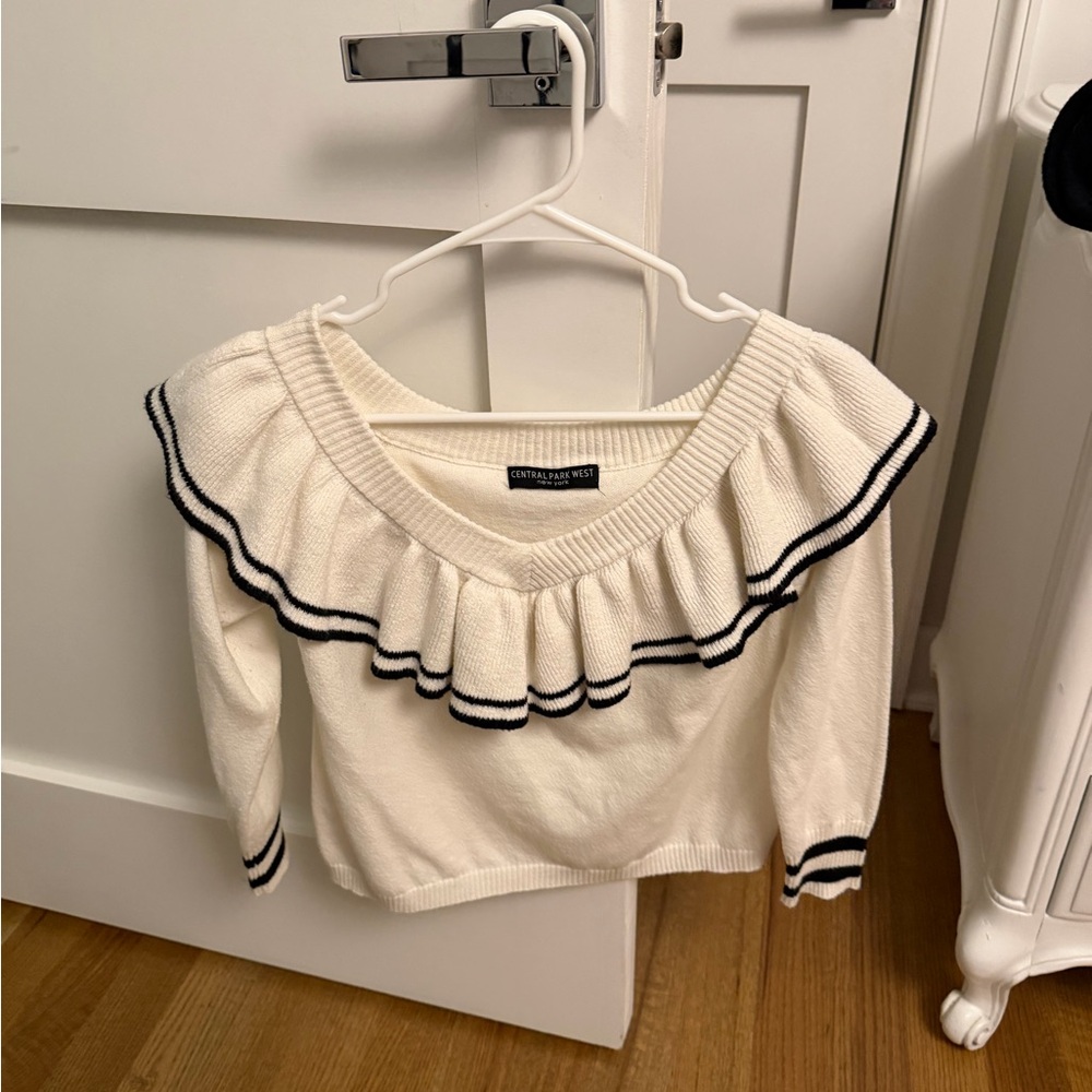 Central Park West sweater. Not sure the size but fits like a xs/s